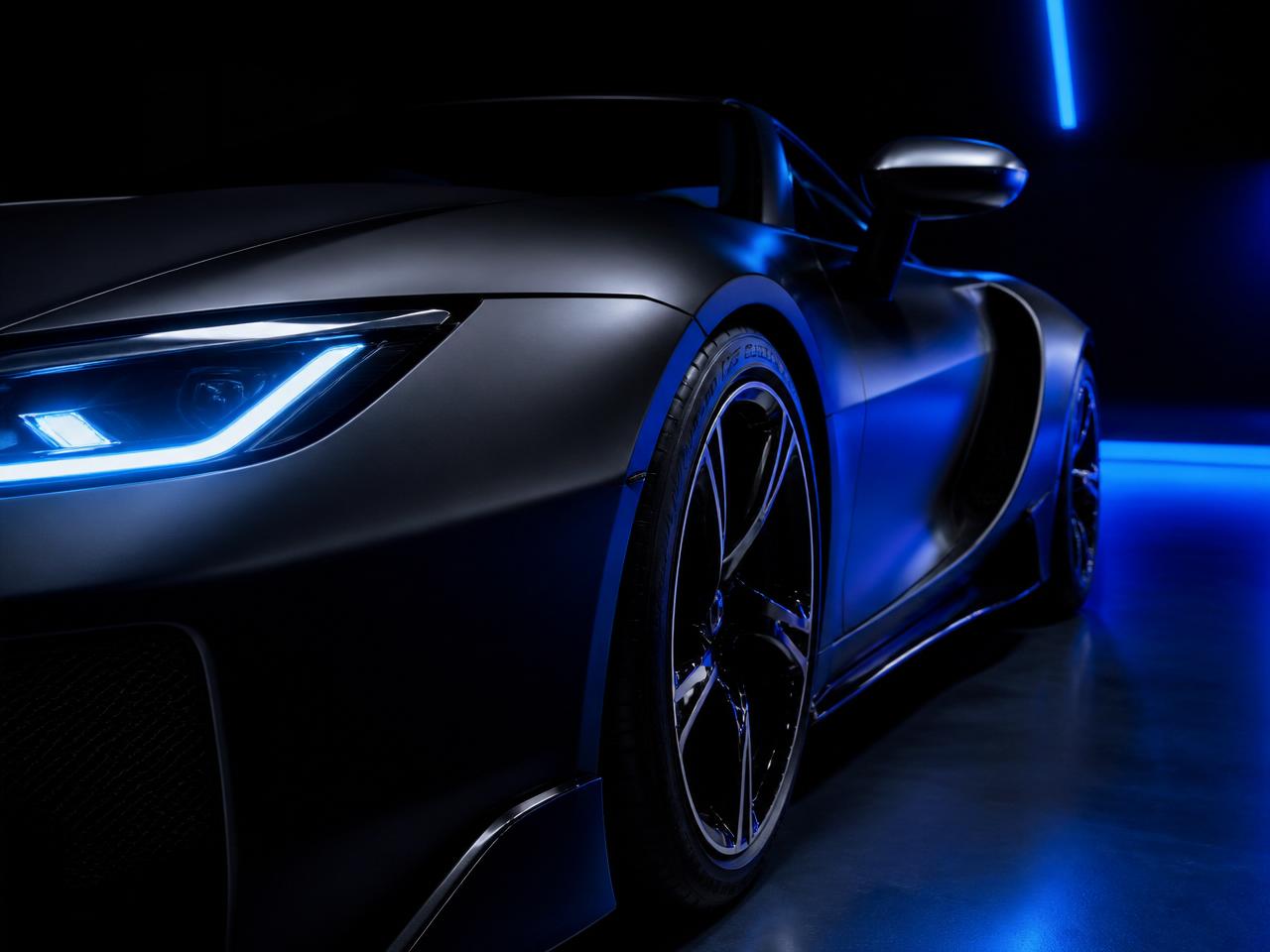 Matte black luxury sports car with electric blue lighting
